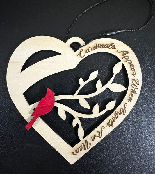 Cardinals Appear with Angels are Near Wooden Ornament